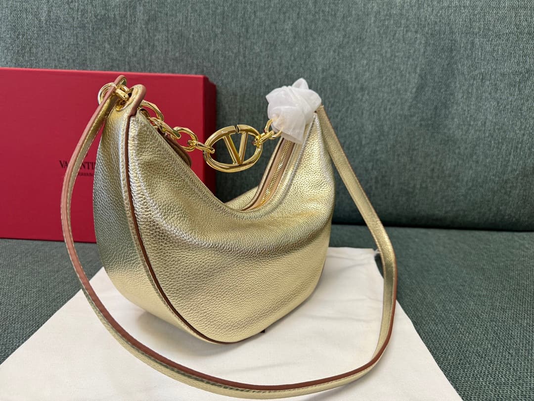 Valentino Garavani VLogo Moon small hobo bag in Gold grained calfskin High