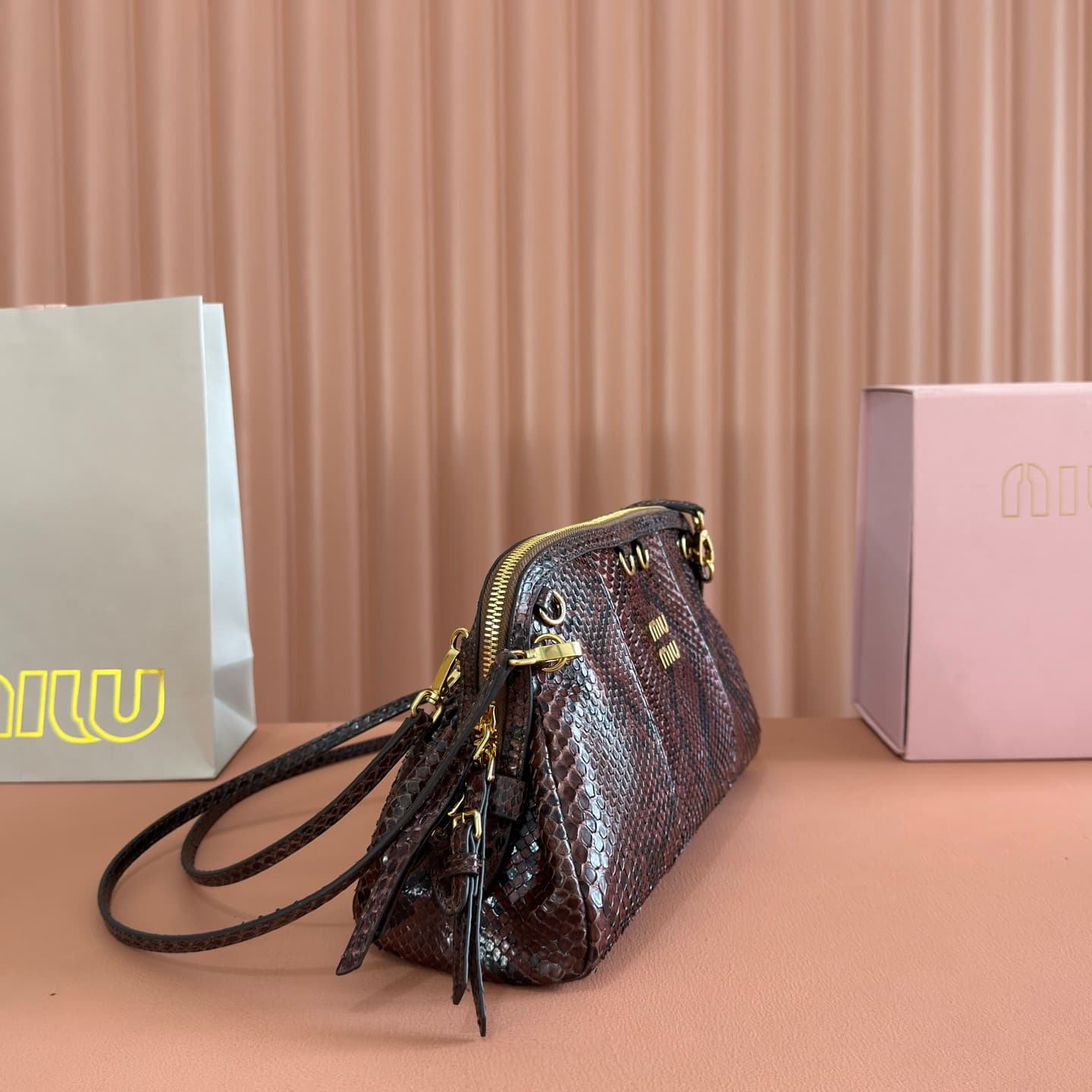 Miu Miu Caprice Tobacco python-print Ayers leather clutch 5BF130 TOP