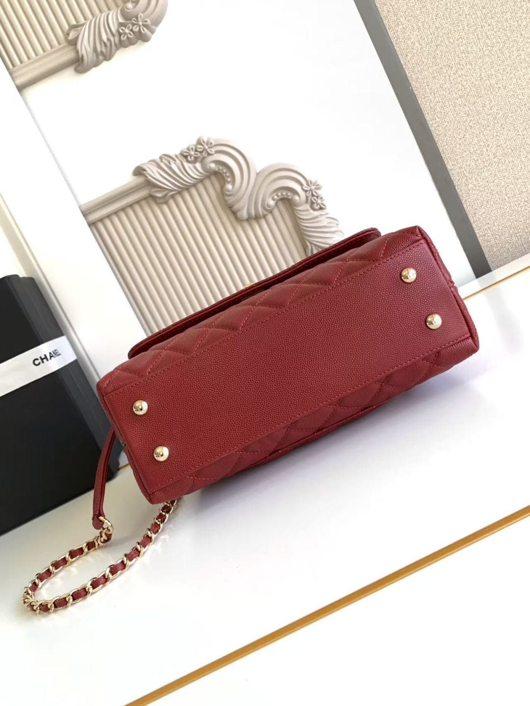 FLAP BAG WITH TOP HANDLE Grained Calfskin & Gold-Tone Metal A92990 Red Binding A