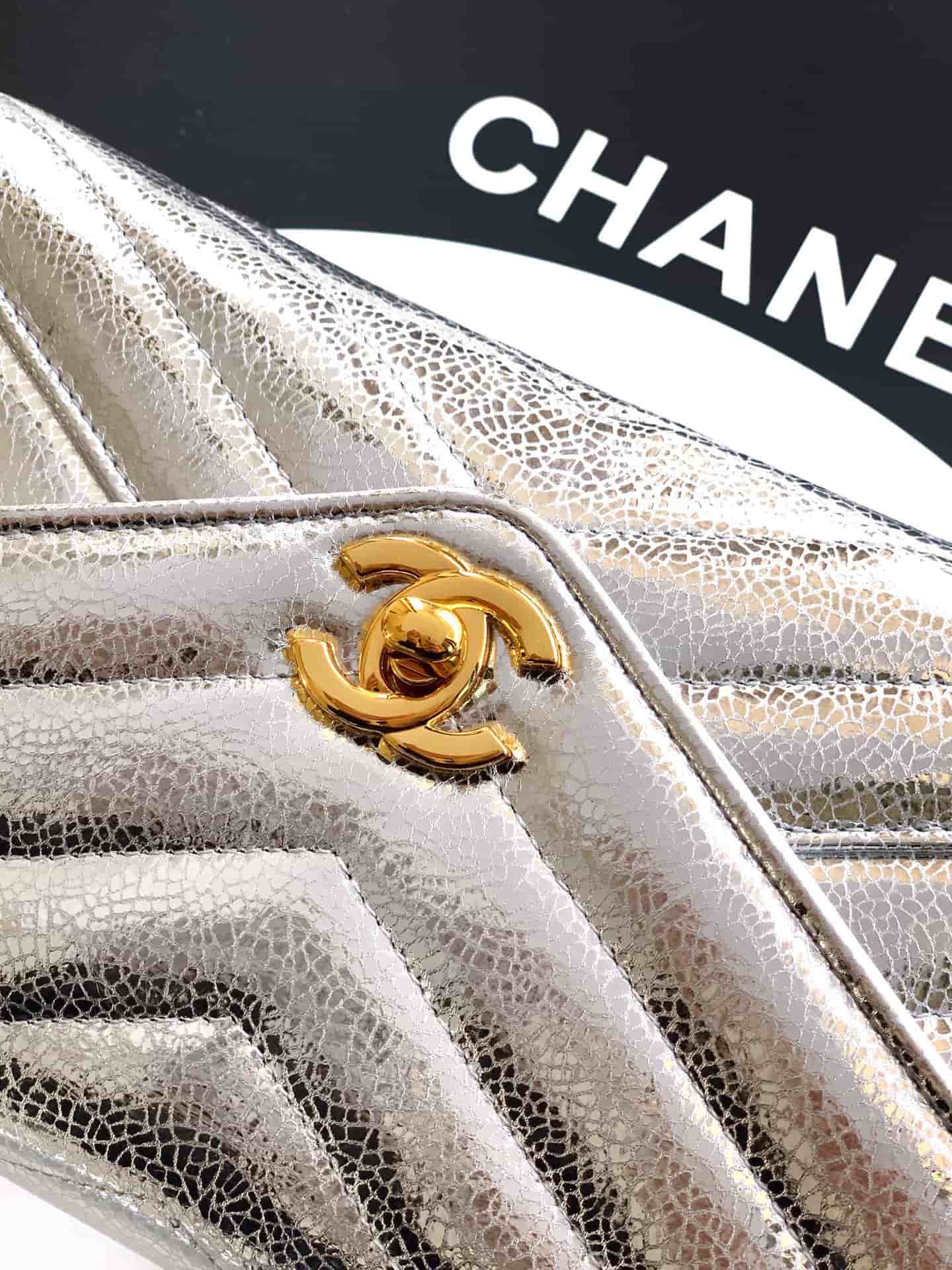 Chanel Flap Bag with Top Handle Metallic Chevron Lambskin Leather Finish& Gold-Tone Metal Silver AS6044 A