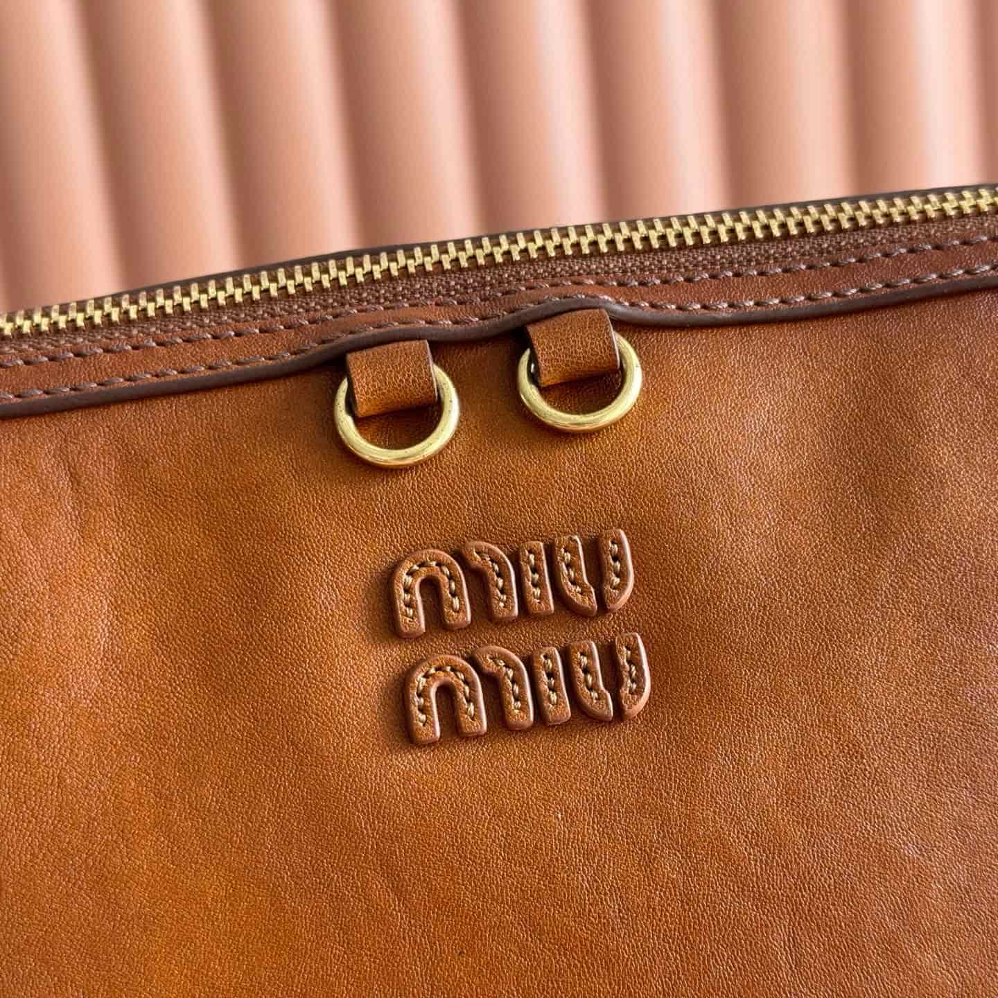 Miu Miu Caprice Calfskin leather clutch Cognac 5BF133
