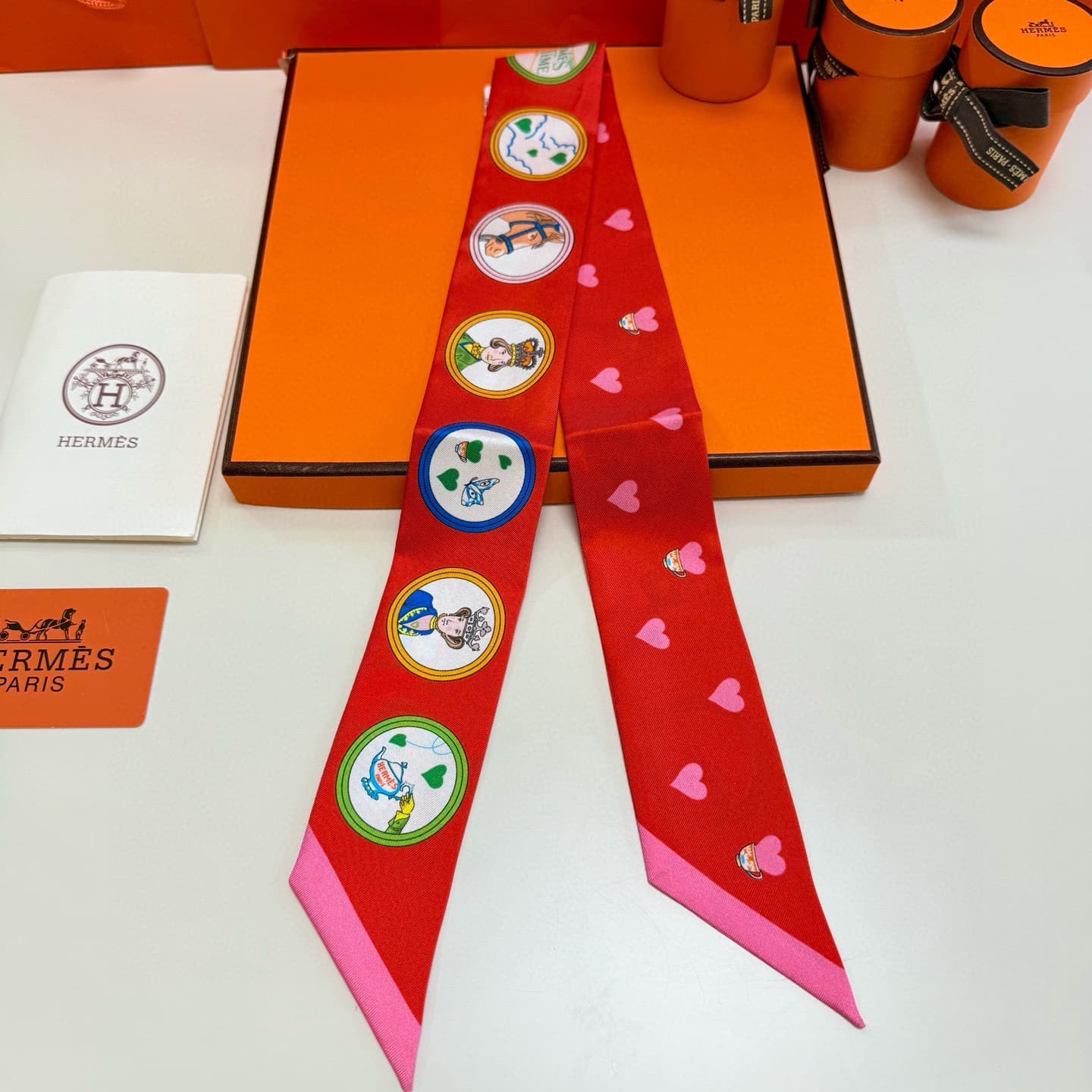 Hermes Twilly scarf featuring the 'Tea Time' motif