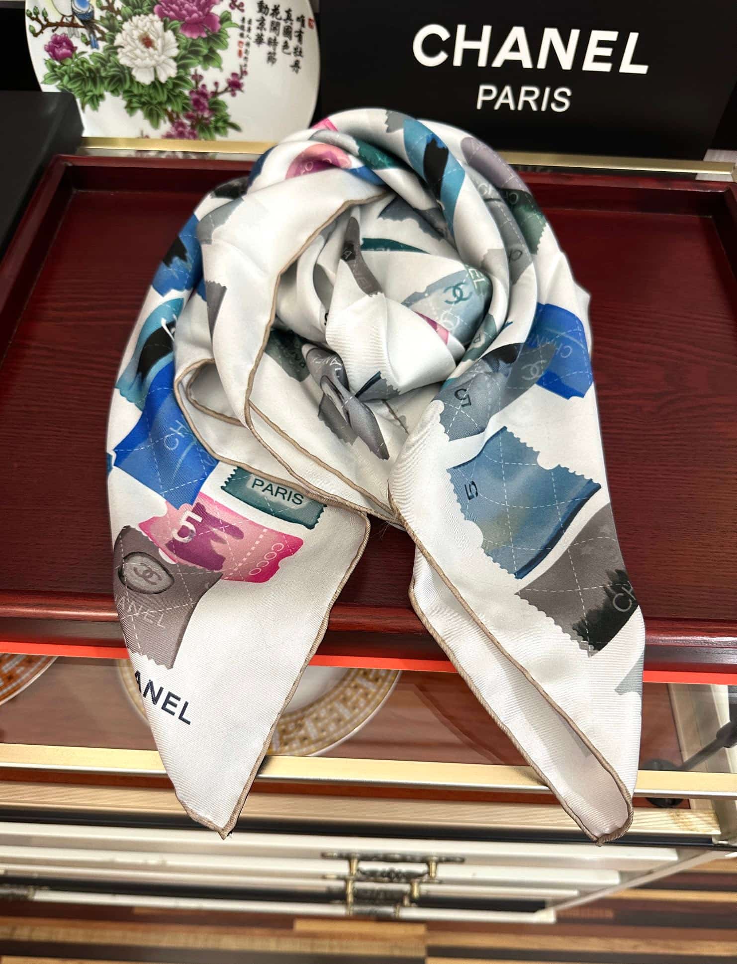 Chanel silk scarf featuring blue and pink stamp print