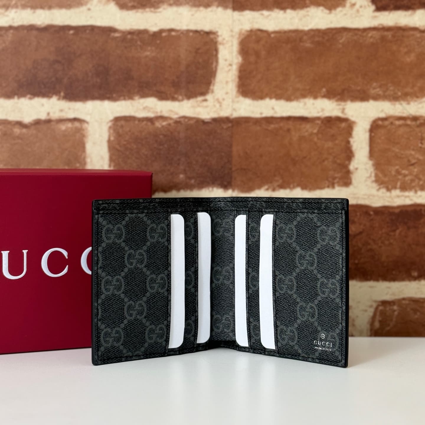 GG Emblem bi-fold wallet with GG fabric Black smooth leather 818949  High